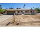 Charming single-story home featuring a two-car garage and desert landscaping, freshly painted exterior at 3045 W Palmaire Ave, Phoenix, AZ 85051