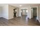 Inviting living space with views of the kitchen, showcasing laminate flooring and modern finishes at 3045 W Palmaire Ave, Phoenix, AZ 85051