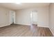 Cozy living room with laminate flooring, featuring access to bedrooms and open spaces at 3045 W Palmaire Ave, Phoenix, AZ 85051