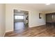 Open-concept living space with wood-look floors and modern lighting fixtures throughout the property at 3045 W Palmaire Ave, Phoenix, AZ 85051