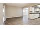 Spacious living room seamlessly connecting to a modern kitchen with stainless steel appliances at 3045 W Palmaire Ave, Phoenix, AZ 85051