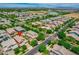 Wide angle aerial shot shows the neighborhood with a community pool, landscaping, and mountain views at 3072 E Appaloosa Rd, Gilbert, AZ 85296