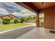 Large backyard with artificial turf, patio and lush, mature trees at 3072 E Appaloosa Rd, Gilbert, AZ 85296