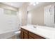 Bright bathroom features a tub with shower and vanity with sink at 3072 E Appaloosa Rd, Gilbert, AZ 85296