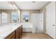 Bright bathroom boasts double sinks, a soaking tub, a walk-in shower, and a window for natural light at 3072 E Appaloosa Rd, Gilbert, AZ 85296