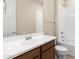 Bright bathroom featuring a white vanity, a sink, and a shower-tub combo at 3072 E Appaloosa Rd, Gilbert, AZ 85296
