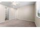 Bright bedroom with plush carpeting, a ceiling fan, and a walk-in closet at 3072 E Appaloosa Rd, Gilbert, AZ 85296