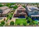 Aerial view of a well maintained backyard featuring a manicured lawn, patio, and desert landscaping at 3072 E Appaloosa Rd, Gilbert, AZ 85296