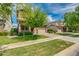 Charming two-story home featuring manicured front yard and a two car garage with a brick driveway at 3072 E Appaloosa Rd, Gilbert, AZ 85296