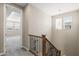 View of the staircase and hallway with carpet flooring, wood trim, and natural lighting at 3072 E Appaloosa Rd, Gilbert, AZ 85296