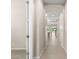 Inviting hallway with tile flooring leads to an open-concept living space and kitchen area at 3072 E Appaloosa Rd, Gilbert, AZ 85296