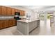 Modern kitchen featuring granite countertops, stainless steel appliances, and a spacious center island at 3072 E Appaloosa Rd, Gilbert, AZ 85296