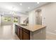 Open concept kitchen featuring a large island, stainless steel sink and modern design at 3072 E Appaloosa Rd, Gilbert, AZ 85296