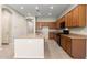 Kitchen features an island with a sink, granite countertops, and modern appliances at 3072 E Appaloosa Rd, Gilbert, AZ 85296
