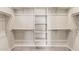 Spacious walk-in closet with ample shelving and metal hanging rods for optimal storage at 3072 E Appaloosa Rd, Gilbert, AZ 85296