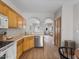Charming kitchen featuring warm wood cabinets, stainless steel appliances, and an open floor plan at 3114 S Eugene --, Mesa, AZ 85212