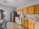 Well-lit kitchen featuring wood cabinets, stainless steel appliances, and a view to the backyard at 3114 S Eugene --, Mesa, AZ 85212