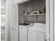 Convenient laundry room featuring a side-by-side washer and dryer with storage shelves above at 3114 S Eugene --, Mesa, AZ 85212