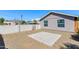 Home's desert-landscaped backyard featuring a small concrete platform at 3601 N 12Th St, Phoenix, AZ 85014