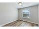 Bedroom with wood-look floors and a large window providing plenty of natural light at 3601 N 12Th St, Phoenix, AZ 85014