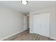 Bright bedroom featuring wood-look floors and a closet with sliding doors at 3601 N 12Th St, Phoenix, AZ 85014