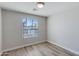 Light-filled bedroom boasts wood-look floors and a window overlooking the neighborhood at 3601 N 12Th St, Phoenix, AZ 85014