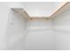 Walk-in closet with white walls and two wooden hanging bars for ample storage at 3601 N 12Th St, Phoenix, AZ 85014