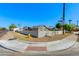 Neighborhood corner with a light gray house behind a block wall on a property with minimal desert landscaping at 3601 N 12Th St, Phoenix, AZ 85014