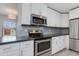 Updated kitchen showcasing stainless steel appliances, and white cabinets at 3601 N 12Th St, Phoenix, AZ 85014