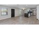 Open-concept living area with gray counters and stainless steel appliances at 3601 N 12Th St, Phoenix, AZ 85014
