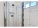 Shower features vertical black and gray tile, white walls, and glass enclosure at 3601 N 12Th St, Phoenix, AZ 85014