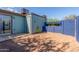 Enclosed backyard with patio area, block wall, and desert landscaping at 3645 N 69Th Ave # 12, Phoenix, AZ 85033