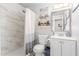 Updated bathroom with marble tile shower, modern vanity, and decorative accents at 3645 N 69Th Ave # 12, Phoenix, AZ 85033