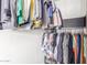 Organized walk-in closet with hanging clothes and additional storage space at 3645 N 69Th Ave # 12, Phoenix, AZ 85033
