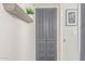 Hallway with decorative wall shelves and built-in storage cabinets at 3645 N 69Th Ave # 12, Phoenix, AZ 85033