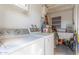 Functional laundry room with washer, dryer, and additional storage space at 3645 N 69Th Ave # 12, Phoenix, AZ 85033