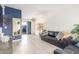 Comfortable living room with ample seating, stylish decor, and access to outdoor space at 3645 N 69Th Ave # 12, Phoenix, AZ 85033