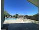 Backyard with pool, built in fire pit, travertine pavers, palm trees and mountain views at 514 E Pearce Rd, Phoenix, AZ 85042
