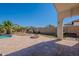 Backyard with an outdoor firepit and a covered patio, perfect for relaxing or entertaining at 514 E Pearce Rd, Phoenix, AZ 85042