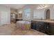 Primary bathroom featuring a large soaking tub and updated vanity with a tiled shower at 514 E Pearce Rd, Phoenix, AZ 85042