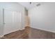 Bedroom showcasing hardwood floors, a closet, and neutral colored walls at 514 E Pearce Rd, Phoenix, AZ 85042