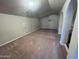 Spacious carpeted bonus room featuring vaulted ceilings and neutral walls, ready for customization and entertainment at 514 E Pearce Rd, Phoenix, AZ 85042