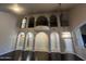Soaring ceilings and arched walkways define this living room, enhanced by dark floors and decorative lighting at 514 E Pearce Rd, Phoenix, AZ 85042