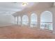 Expansive loft space with a decorative wrought iron railing and unique architectural arches at 514 E Pearce Rd, Phoenix, AZ 85042