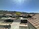 Neighborhood street view showcasing tile-roofed homes and mountain views, presenting a serene community environment at 514 E Pearce Rd, Phoenix, AZ 85042