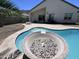 Backyard pool with built-in fire pit and covered patio offers a relaxing outdoor retreat at 514 E Pearce Rd, Phoenix, AZ 85042