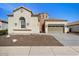 Charming single-Gathering home featuring desert landscaping, two-car garage, and barrel tile roof at 514 E Pearce Rd, Phoenix, AZ 85042