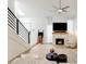 Inviting living room with fireplace, fan, and lots of natural light from the staircase skylight at 5350 N 3Rd Ave, Phoenix, AZ 85013