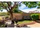 Relaxing backyard area featuring a small fountain, chairs, and stone pavers at 5423 W Range Mule Dr, Phoenix, AZ 85083