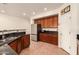 Spacious kitchen with stainless steel refrigerator, granite countertops, and ample cabinet space at 5423 W Range Mule Dr, Phoenix, AZ 85083